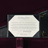 Certificate of Authenticity for a Martin guitar on a dark background