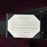 Certificate of authenticity for a Martin guitar on a dark background