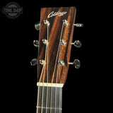 Collings guitar headstock with brand name on a black background