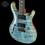 Blue electric guitar with a black background