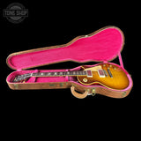 Gibson Les Paul guitar in a pink-lined case with 'Tone Shop' logo.