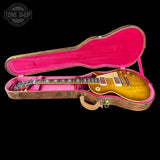 Gibson Les Paul guitar in a pink-lined case with 'Tone Shop' logo.
