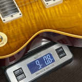 Guitar on a digital scale displaying weight