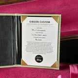 Gibson Custom Certificate of Authenticity on a red background