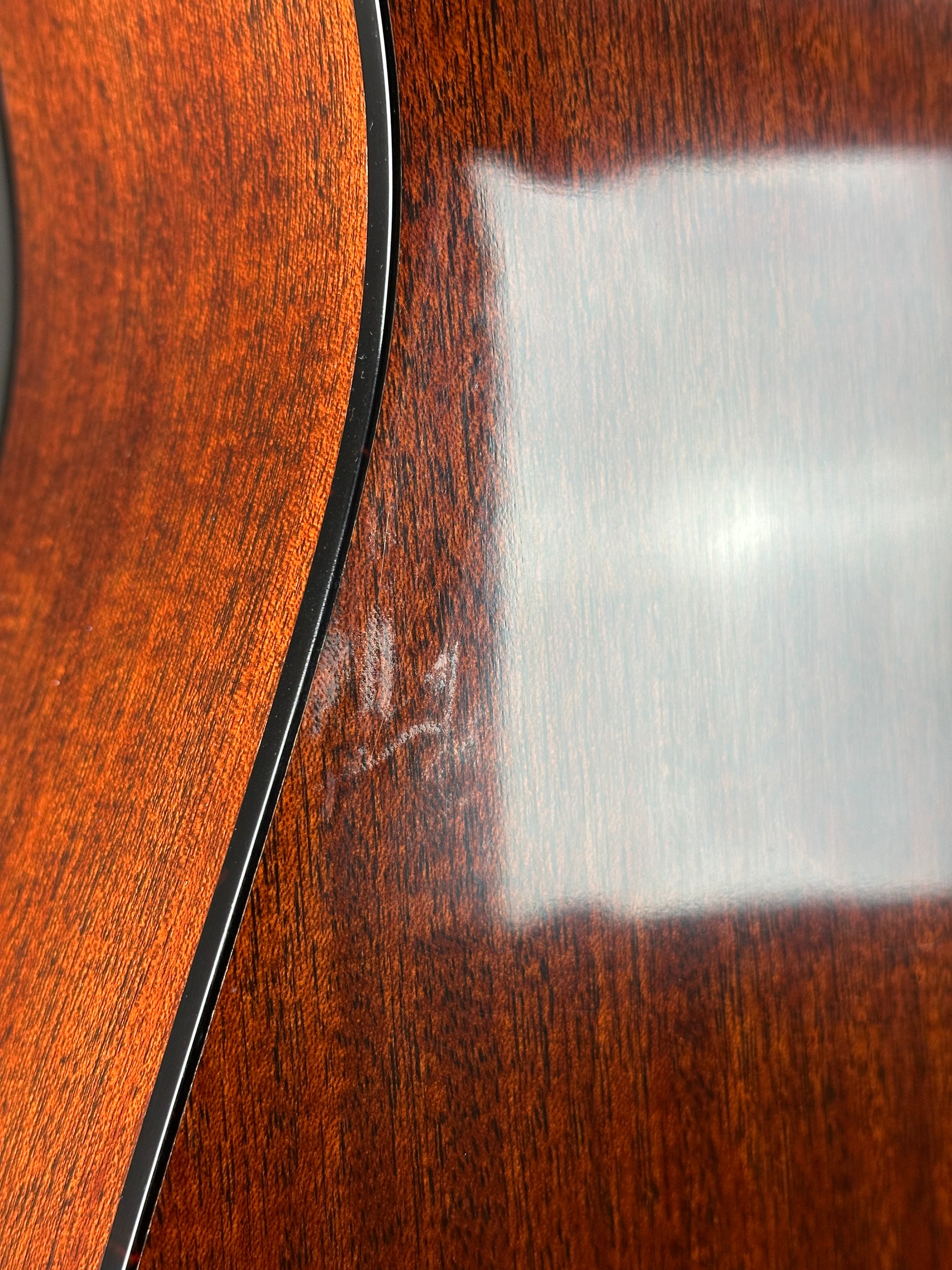 Close-up of a wooden surface with a white rectangular object on top