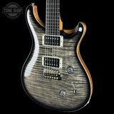 Front angle of PRS Custom 24 Birds of a Feather Limited Charcoal Microburst.