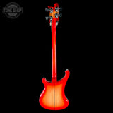 Red electric bass guitar on a black background with 'Tone Shop' logo.