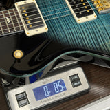 PRS Tremonti Trem 10 Top Cobalt Smokeburst on scale displaying weight.