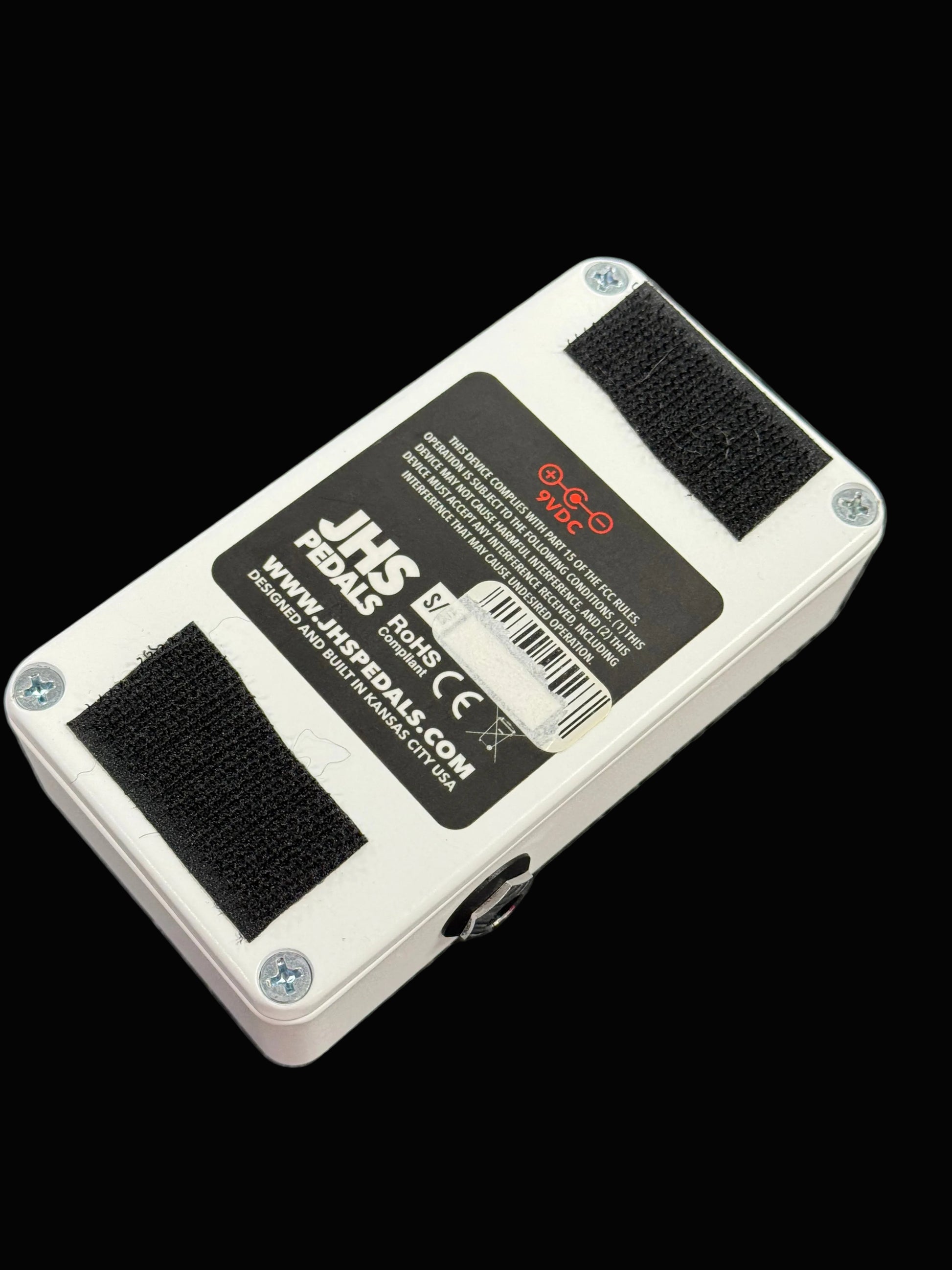 JHS Pedals guitar effects pedal on a wooden surface