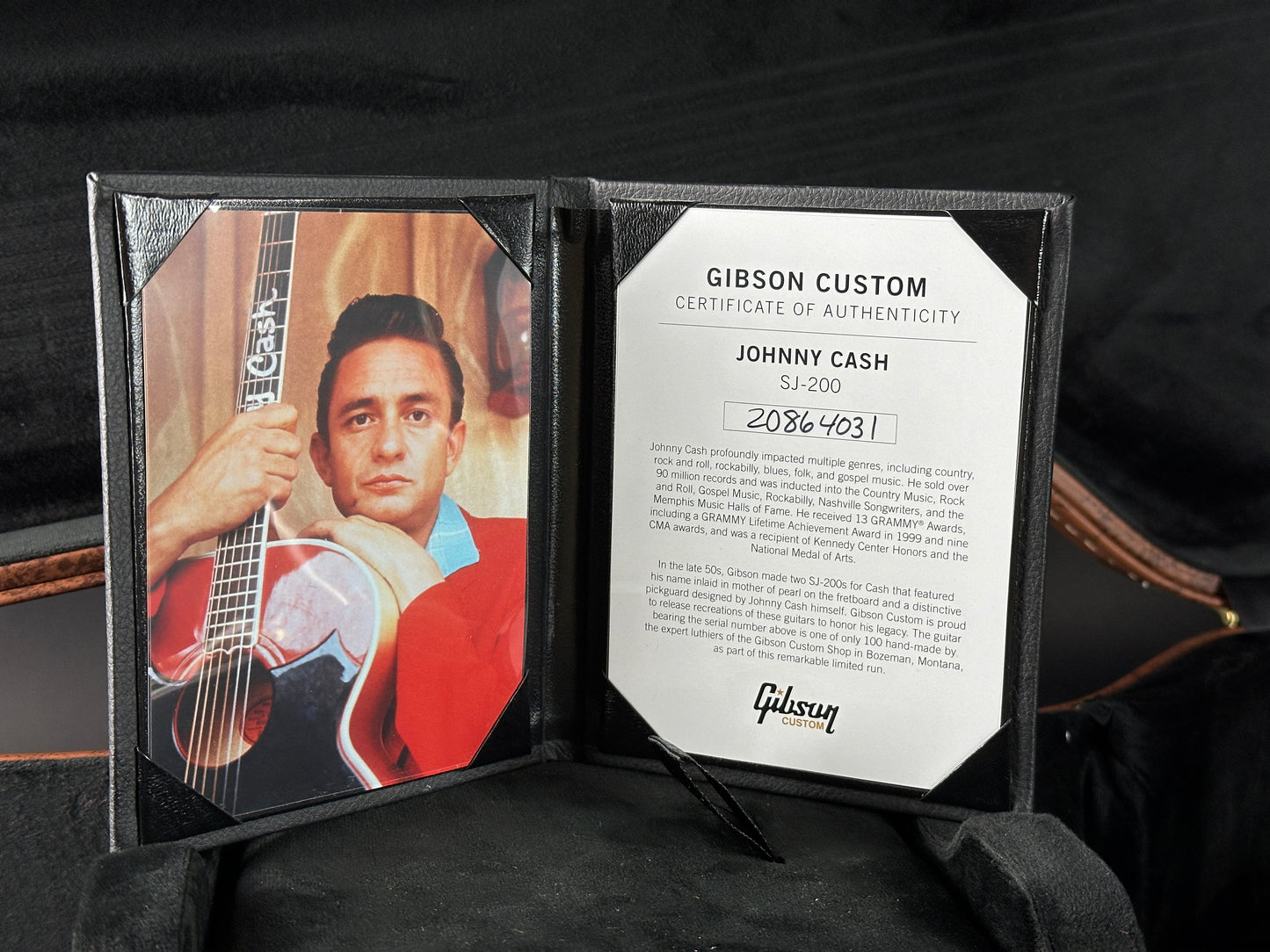 Gibson Custom Certificate of Authenticity for Johnny Cash with a guitar image on a dark background
