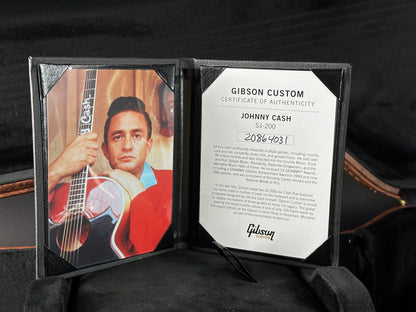 Gibson Custom Certificate of Authenticity for Johnny Cash with a guitar image on a dark background
