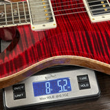 PRS Select Wood Library McCarty Trem 10 Top Red Tiger on scale displaying weight.
