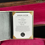 Gibson Custom Certificate of Authenticity on a maroon background