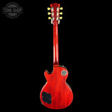 Red electric guitar on a black background with 'Tone Shop' logo.