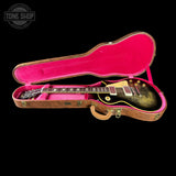 Gibson Les Paul guitar in a pink-lined case with 'Tone Shop' logo.