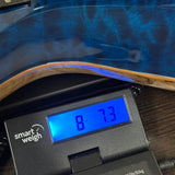 Used Kiesel CT624M Blue Quilt Top Black Limba on scale displaying weight.