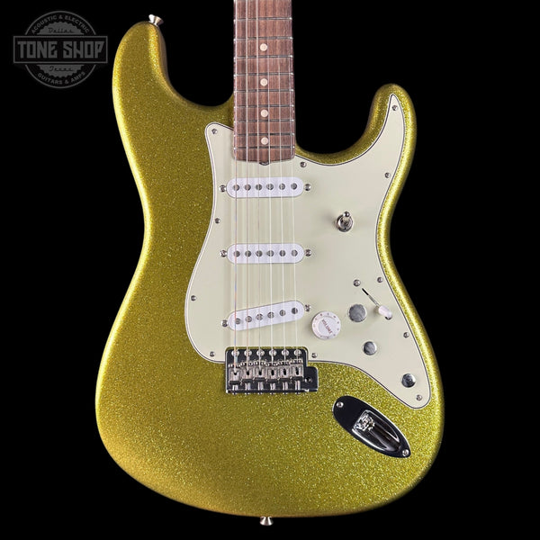 Gold glitter electric guitar on a black background with 'Tone Shop' logo.
