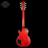 Red electric guitar on a black background with 'Tone Shop' logo.