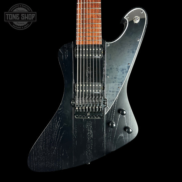 A black electric guitar with a distressed black finish, featuring a maple neck with a brown fingerboard and chrome hardware, shown against a solid black background with a Tone Shop logo in the top-left corner.