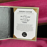 Gibson Custom Certificate of Authenticity on a maroon background