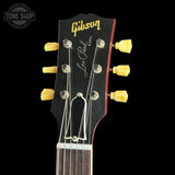 Gibson Les Paul guitar headstock with brand logo on a black background