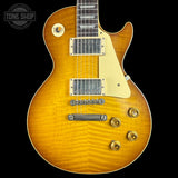 Electric guitar with a sunburst finish on a black background, featuring the Tone Shop logo.