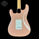 Electric guitar with a shell pink finish on a black background, featuring the Tone Shop logo.
