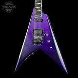 Purple electric guitar with a black background
