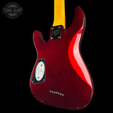 The back of a Fender Stratocaster electric guitar in a glossy deep red finish, featuring a yellow maple neck and a black pickguard, shown against a solid black background.