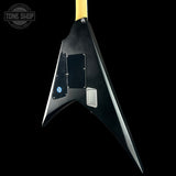 Guitar body with a black finish and visible brand logo on a black background