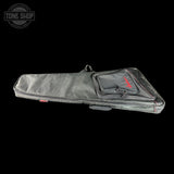 Gray guitar case with red logo on a black background, featuring the Tone Shop logo.