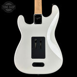 White electric guitar body with a visible brand logo on a black background