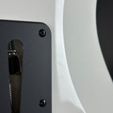 Close-up of a black metal object with a white background
