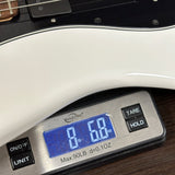Digital scale displaying weight of a guitar