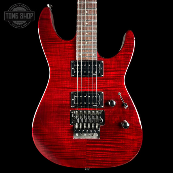 Red electric guitar with a black background