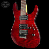 Red electric guitar on a black background with 'Tone Shop' logo.