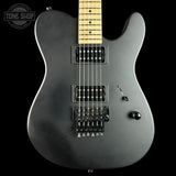 Gray electric guitar with a close-up view on a black background