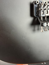 Close-up of a mechanical component on a dark surface