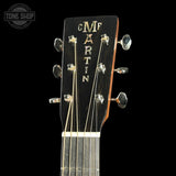 Guitar headstock with 'Martin' branding on a black background