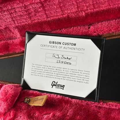 Gibson Custom Certificate of Authenticity on a red guitar case