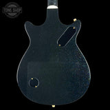 Back view of a black electric guitar with 'Tone Shop' logo.