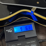 Used 2016 Epiphone Les Paul Custom Ebony Left Handed on scale displaying weight.