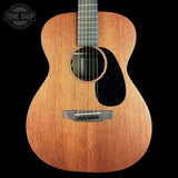 Acoustic guitar with a visible brand logo on a black background