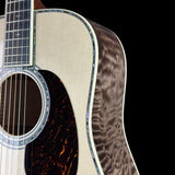 Front detail of Martin Custom Shop  42 Style Torch Motif Adirondack/Master Grade Quilt Maple.
