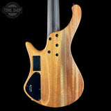 Wooden electric bass guitar with a black pickguard on a black background, featuring the Tone Shop logo.