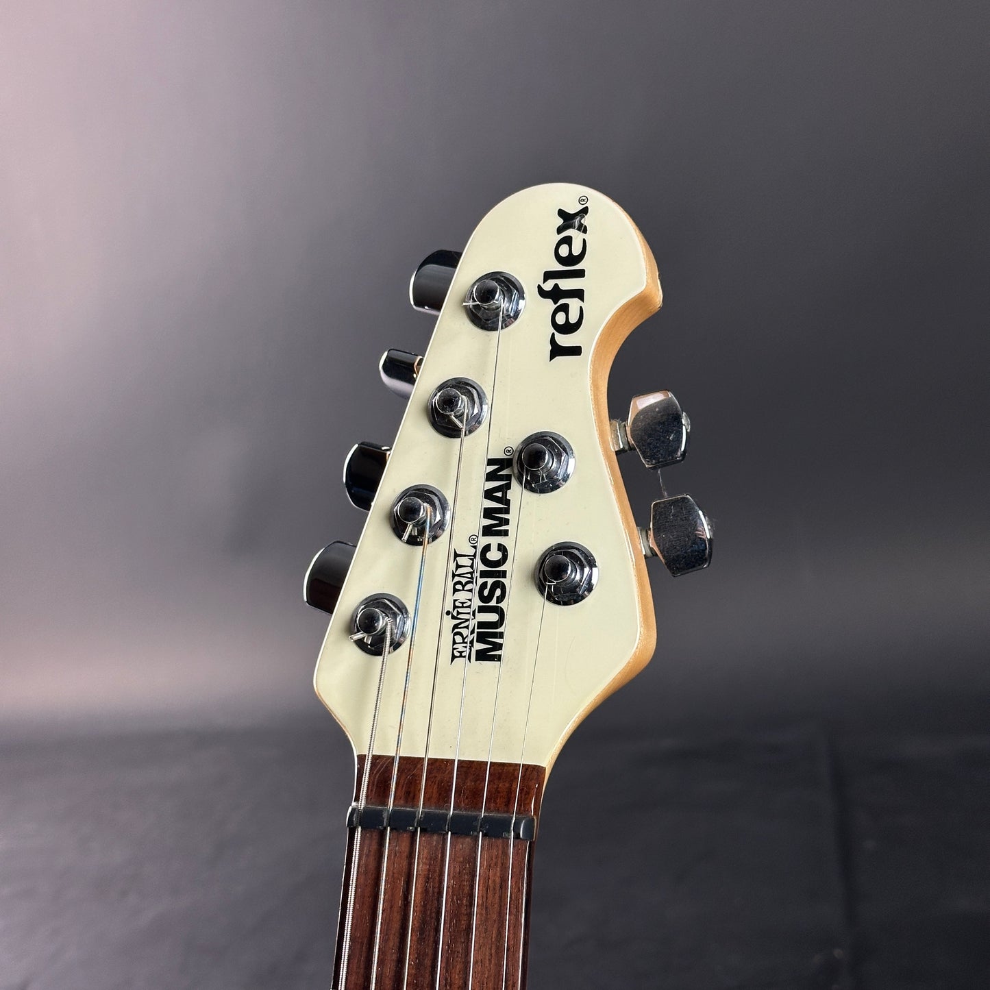 Headstock of Used Ernie Ball Music Man Reflex White.