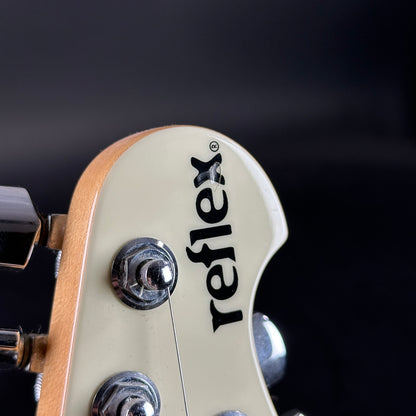 Ding on headstock of Used Ernie Ball Music Man Reflex White.