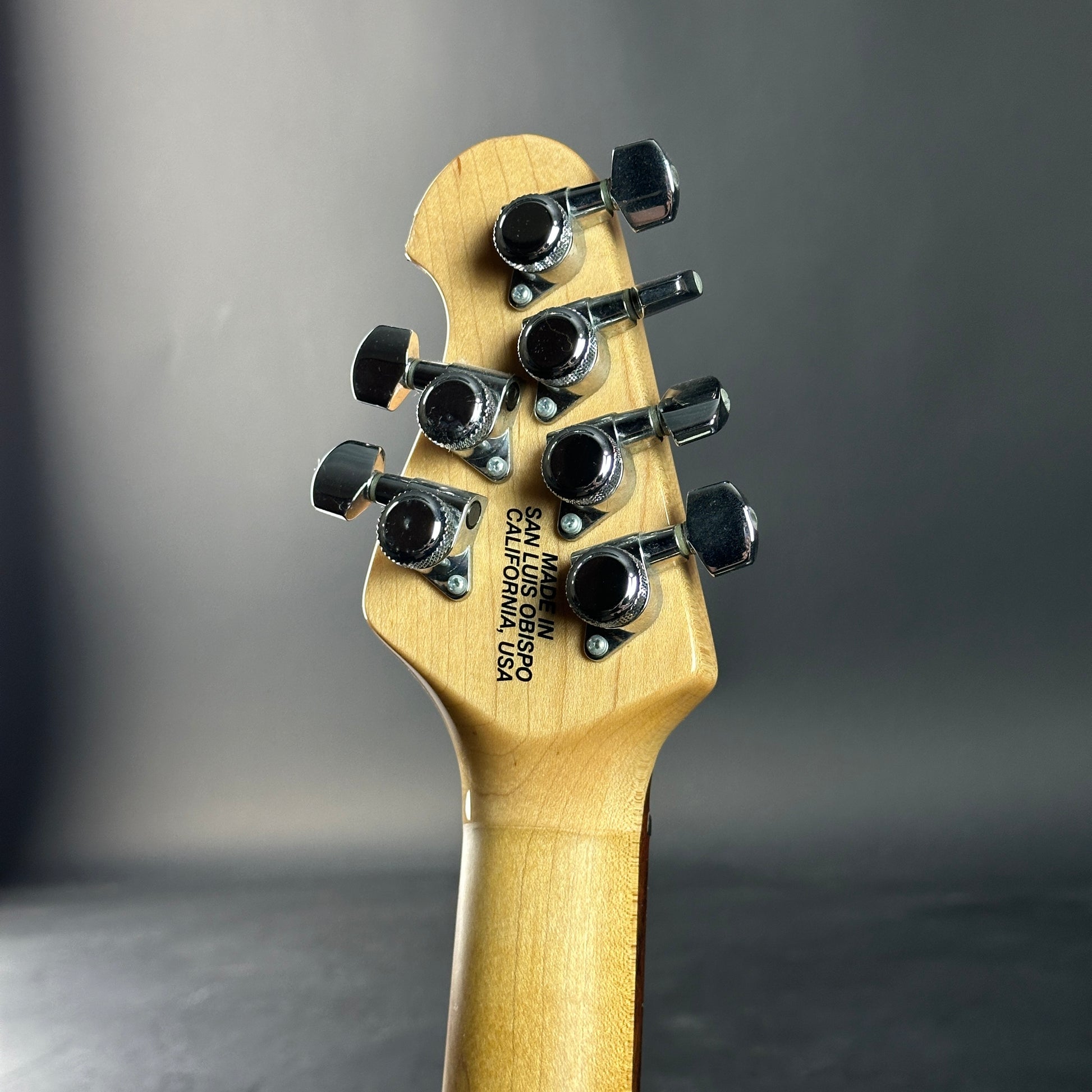 Back of headstock of Used Ernie Ball Music Man Reflex White.