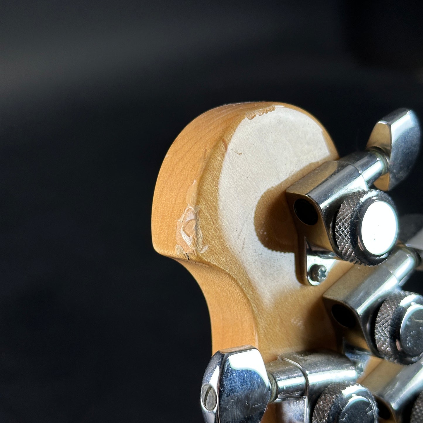 Wear on back of headstock of Used Ernie Ball Music Man Reflex White.