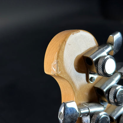 Wear on back of headstock of Used Ernie Ball Music Man Reflex White.